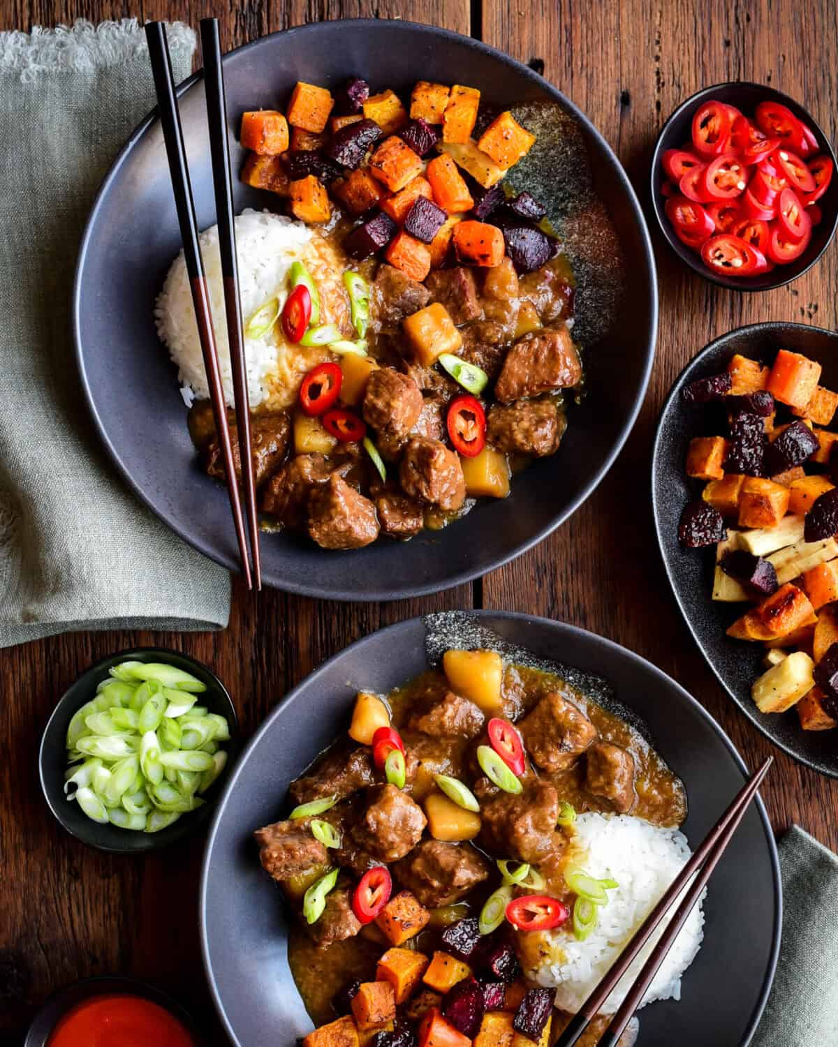 Two bowls of Japanese-Style Beef Stew with Roasted Vegetables and rice.