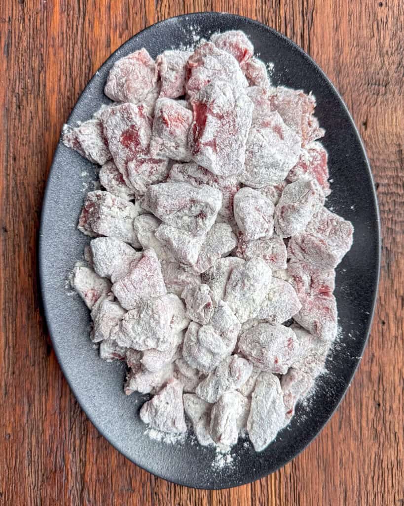 Toss the beef cubes in a flour, salt and pepper mixute.