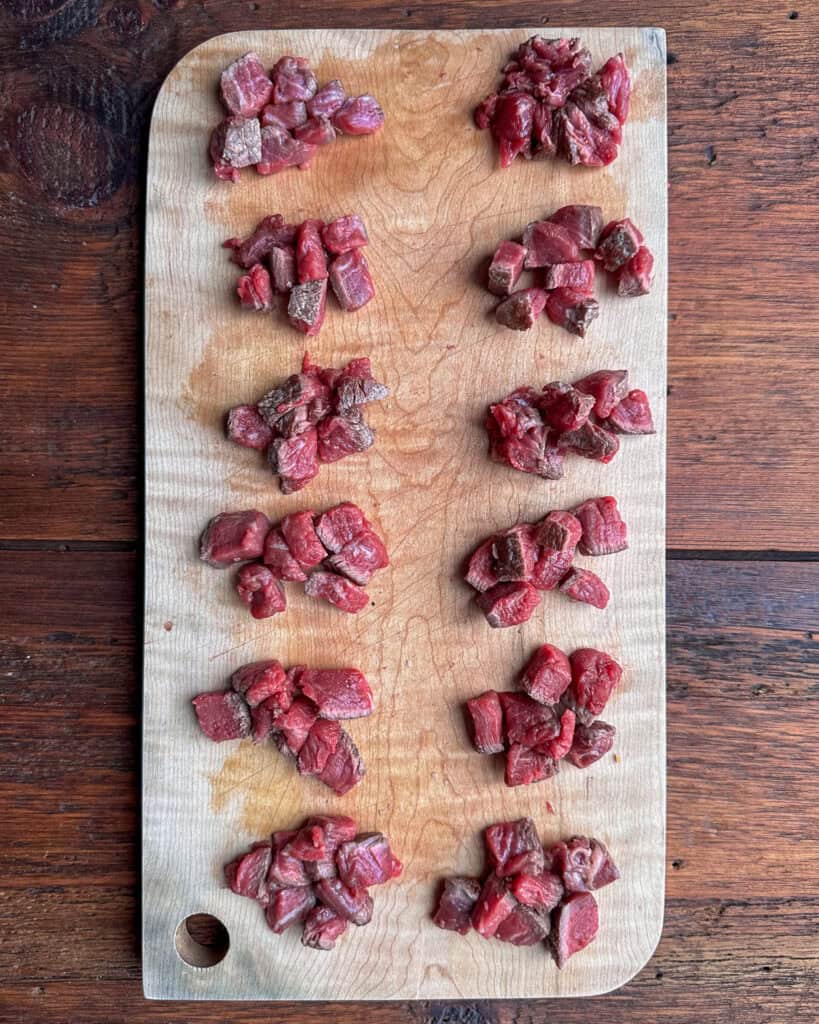 Seared steak sliced into small cubes.