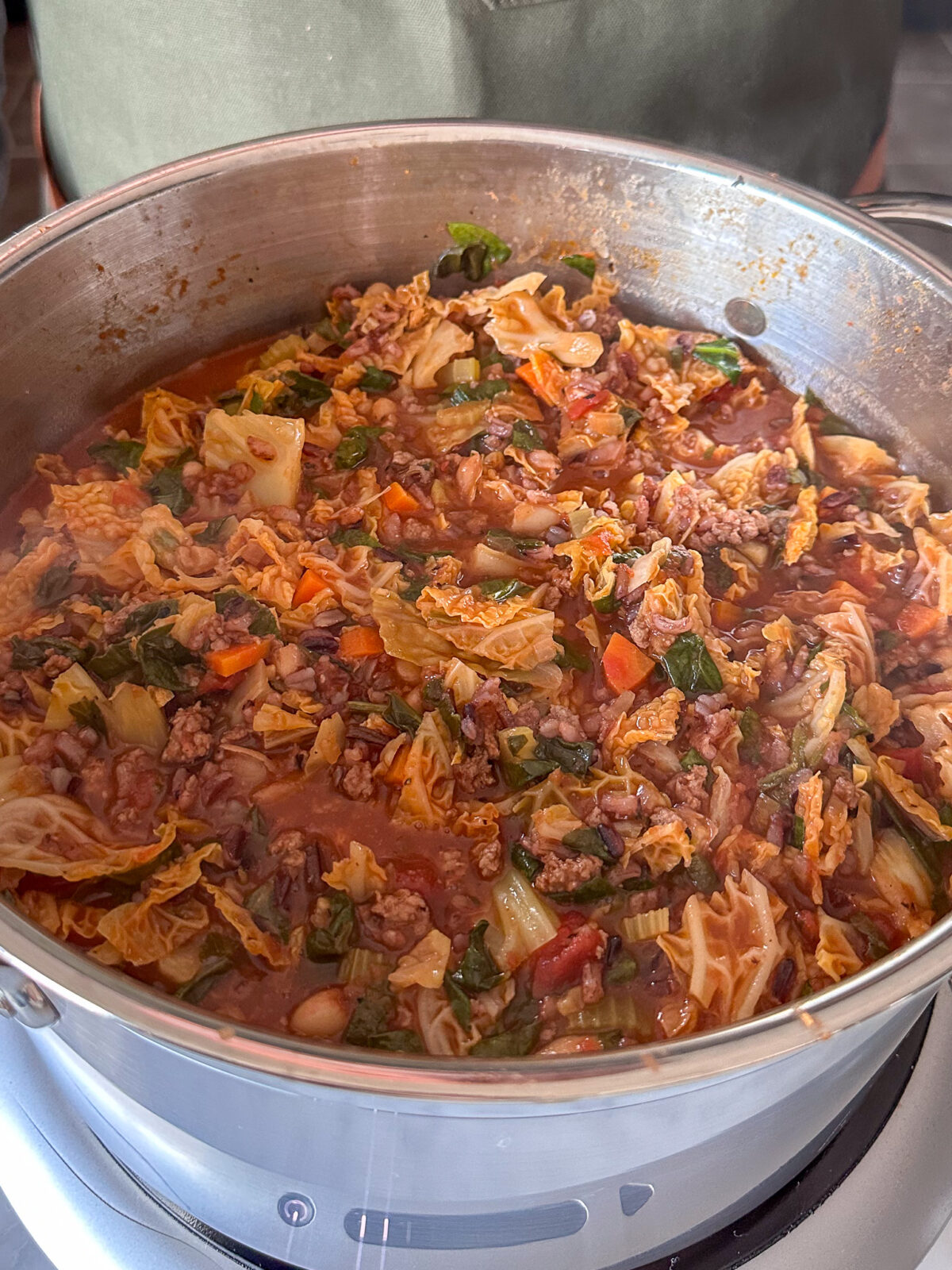 Add the cooked ground beef, cooked wild rice, beans and spinach to the pot. Stir to combine and simmer for an additional 10 to 15 minutes