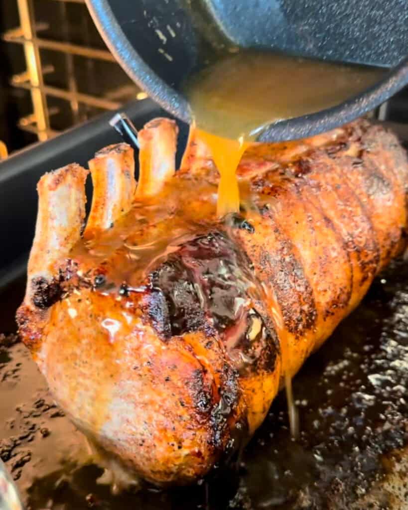 Glaze the pork with a maple Dijon glaze.