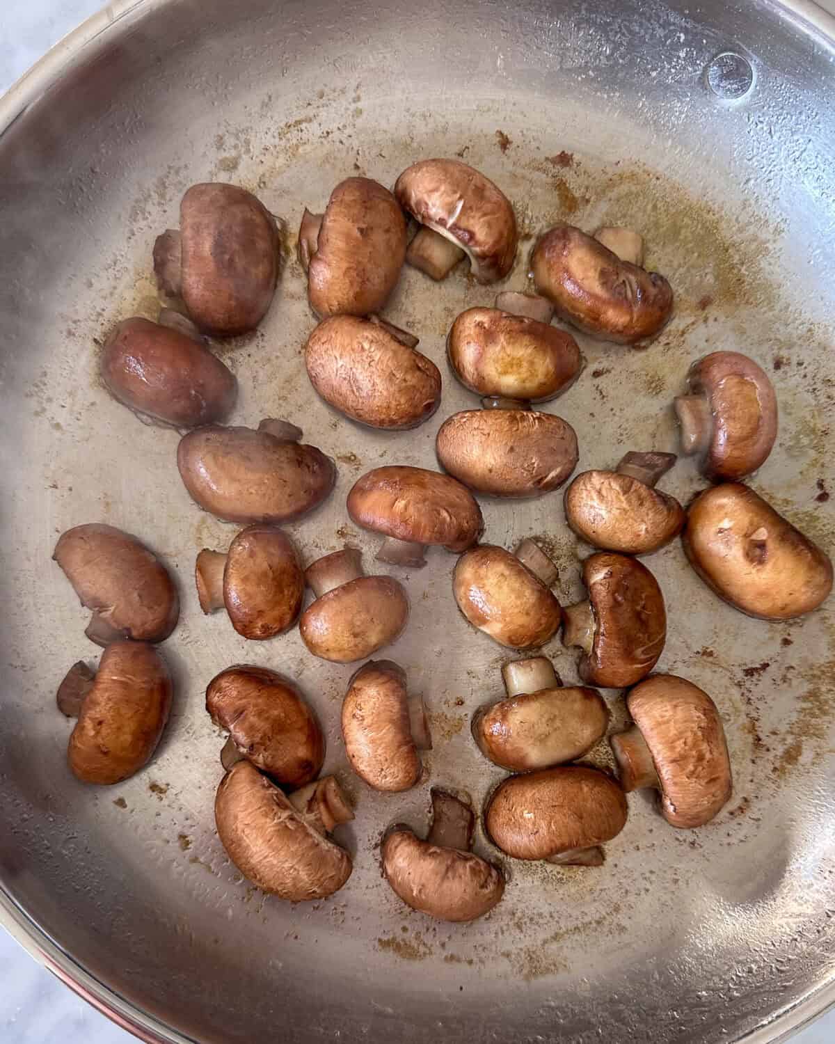 Mushrooms, cut side down to brown in a pan.