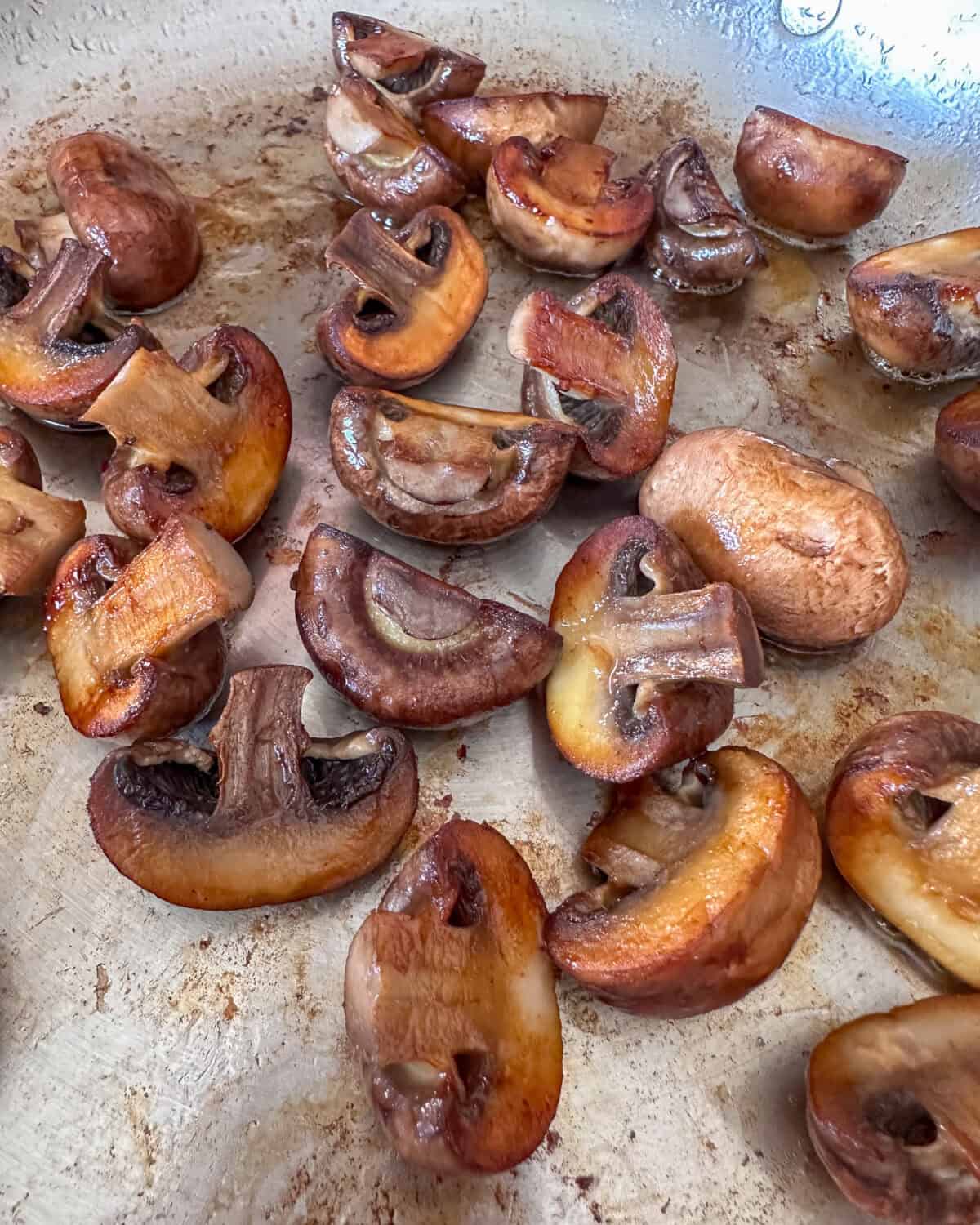 Sauteed mushrooms in a pan.