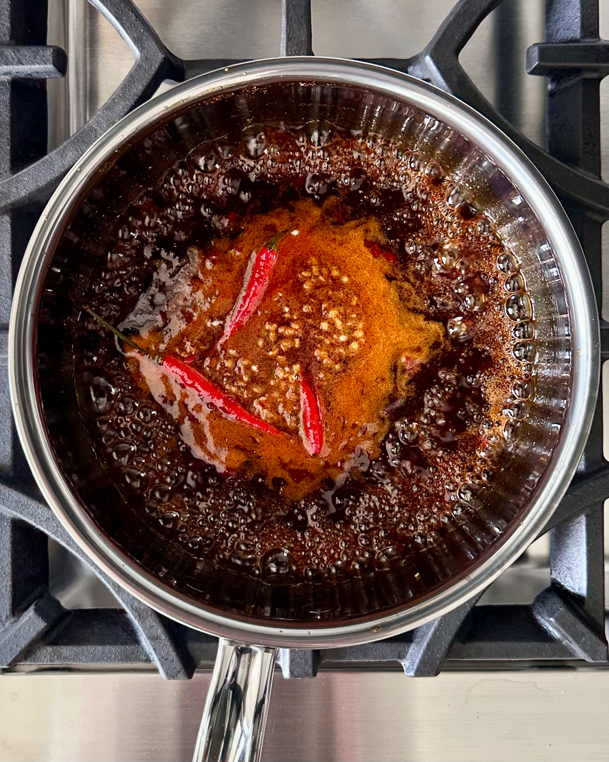 Bring the Chinese Five-Spice Sticky to a light boil, then reduce to a simmer.