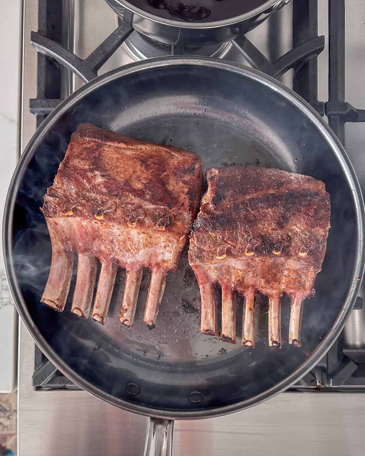 Sear the rib racks for 2-3 minutes per side until nicely browned.