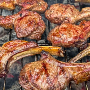 Grilled lamb lollipops over charcoal.