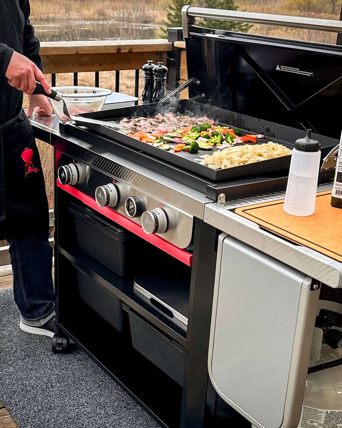 A Weber Slate griddle with a griddled ingredients on it.