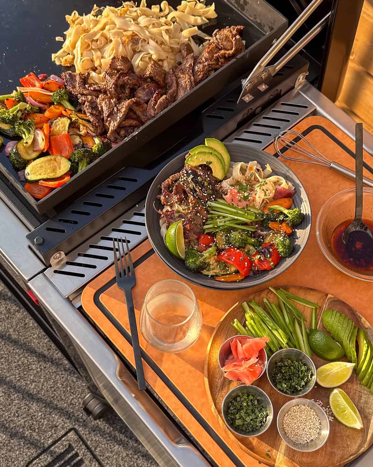 Assemble the noodle bowl straight from the griddle.
