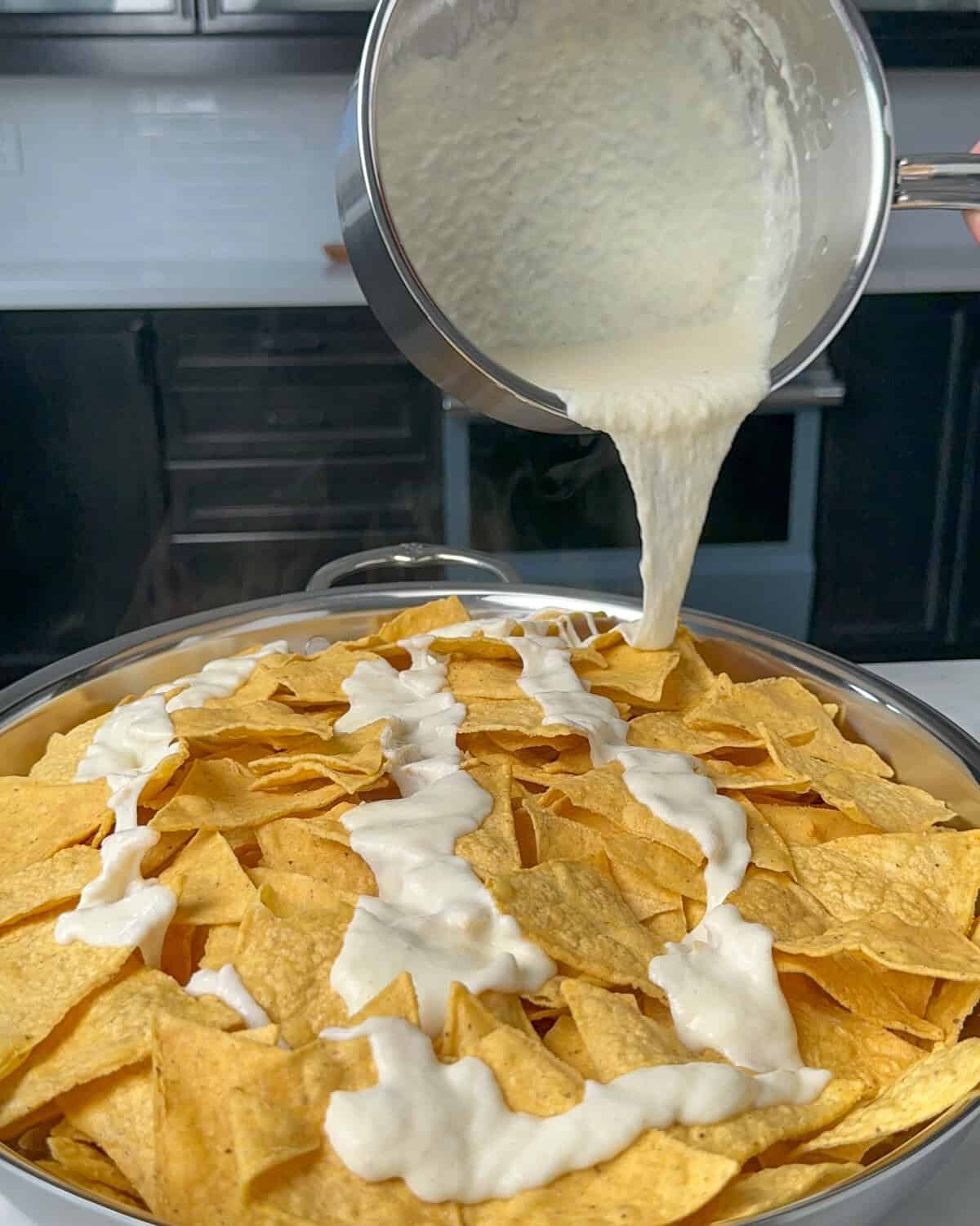 Pour the Oaxaca Fondue over the nachos.