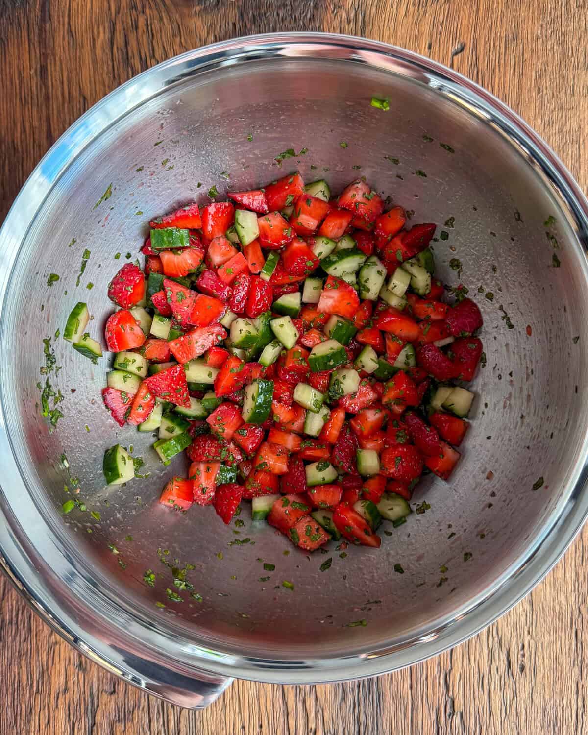 A bowl of salsa for a salmon with strawberry salsa recipe.