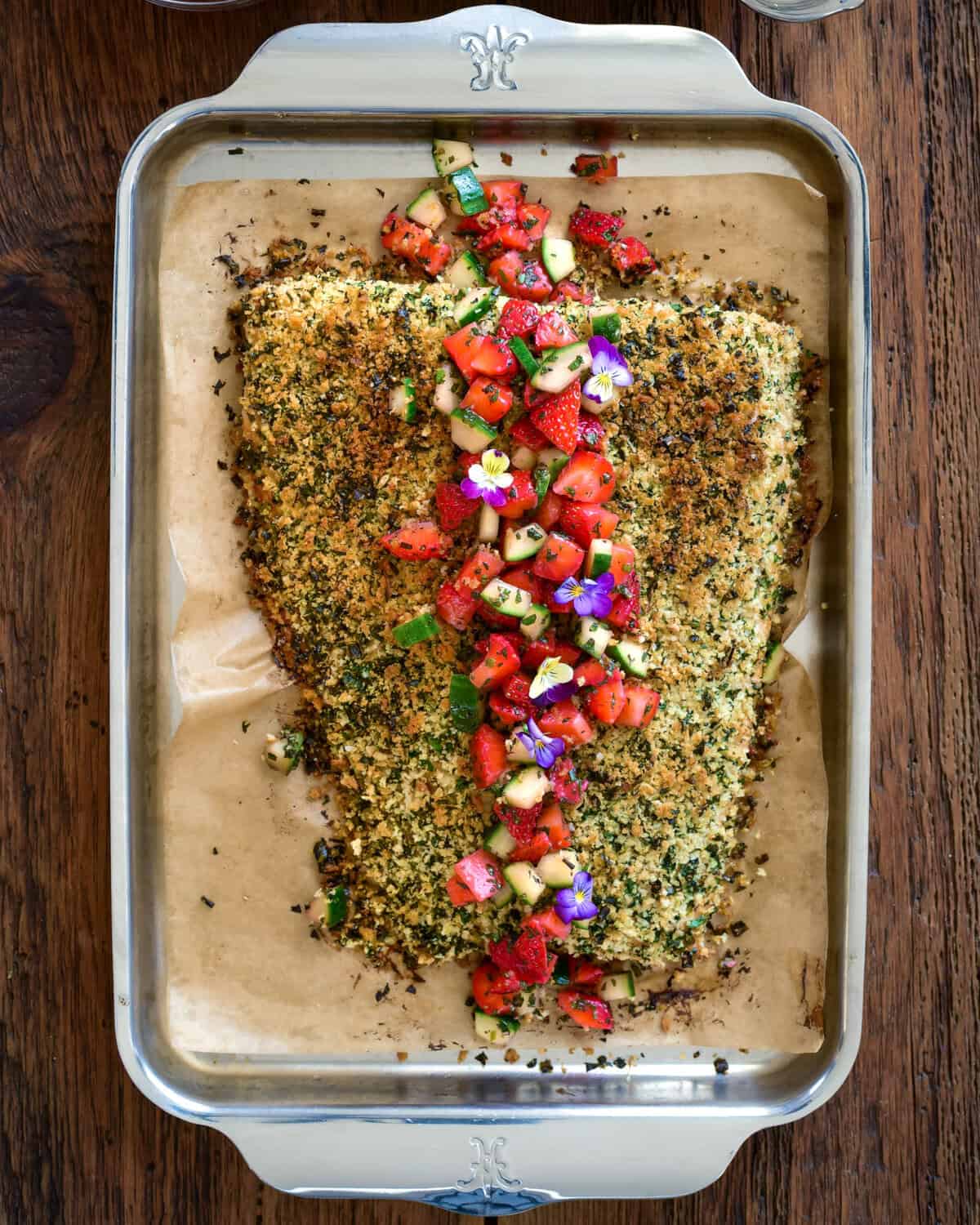 An Herb Crusted Salmon with Strawberry Mint Salsa on a sheet pan.