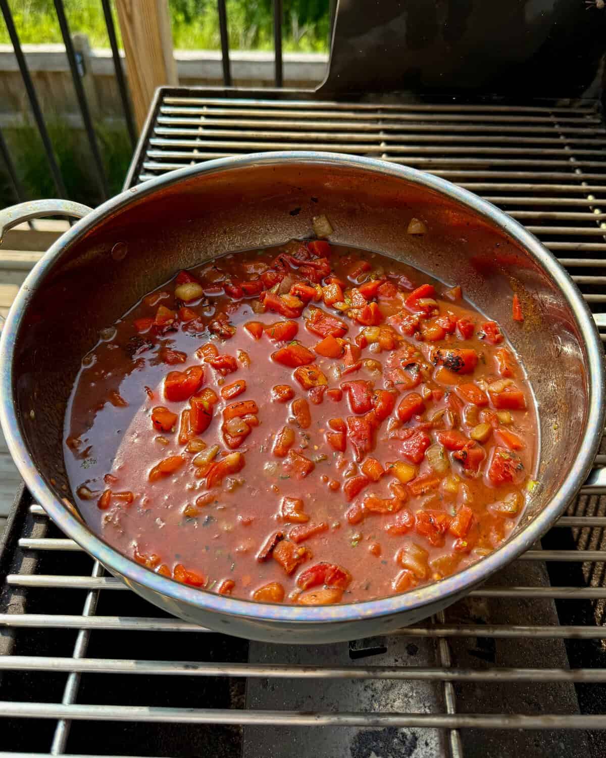 Add the tomato base for the Dutch oven baked beans.