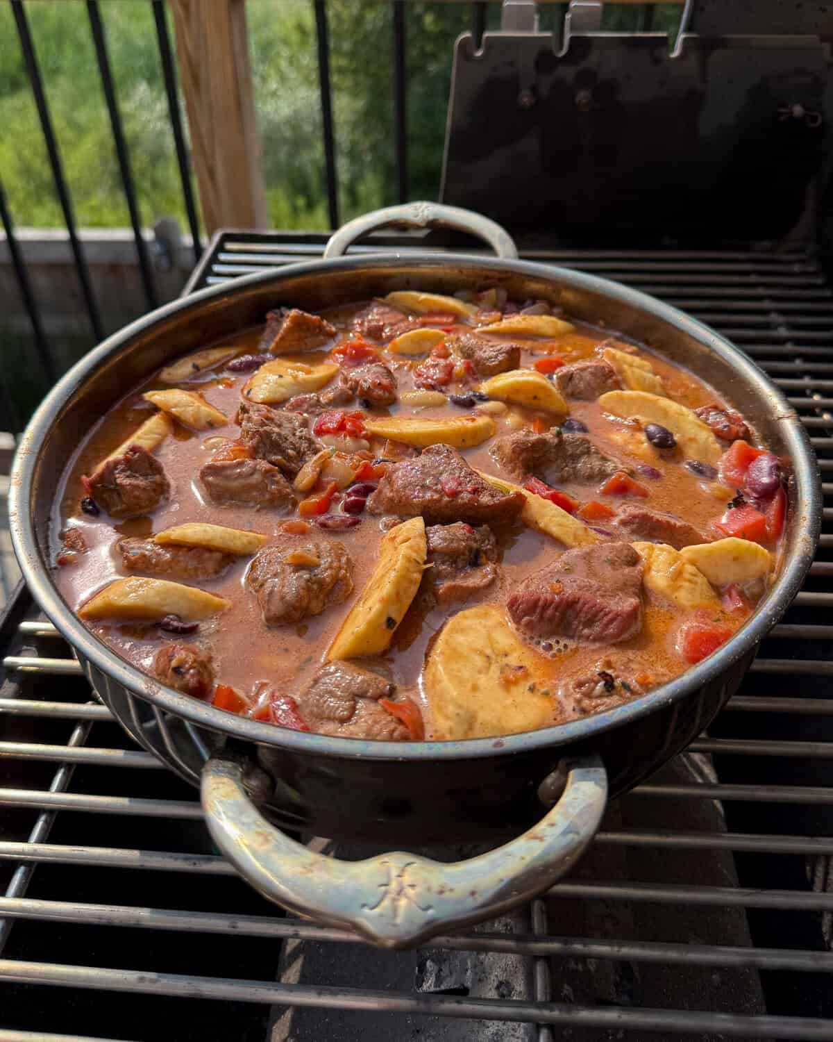 Nestle the plantains into the Dutch oven baked beans.