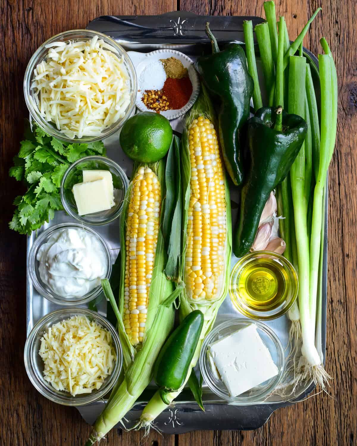 Ingredients for a corn and poblano dip with jalapenos.