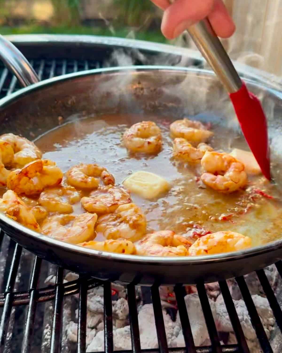 Stir the butter into the shrimp sauce. This will get poured over a grilled steak.