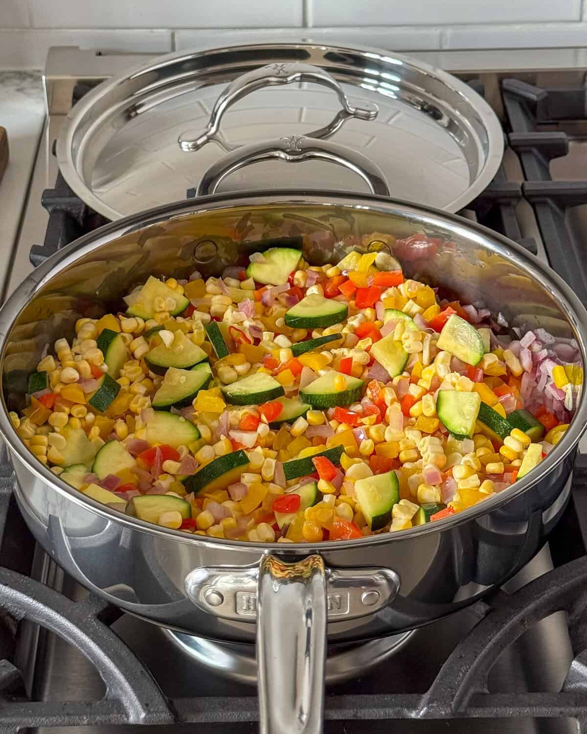 A the corn into the pan with summer shakshuka.