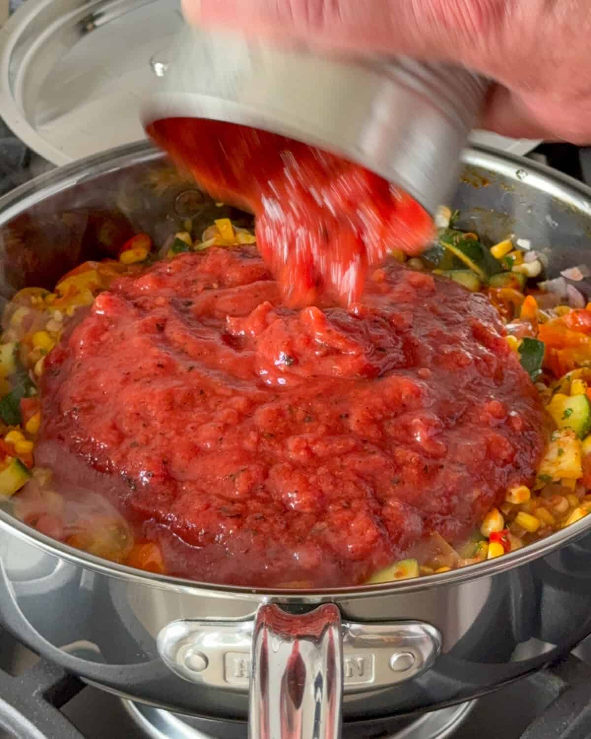 Add the crushed tomatoes.