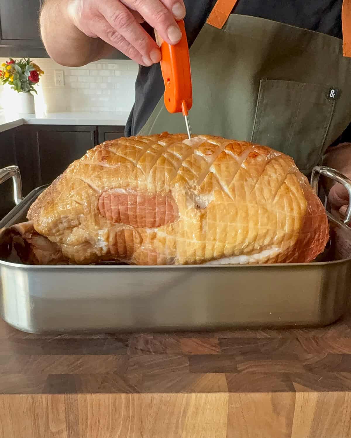 Use a digital thermometer to check that the ham's internal temperature reaches 125–130°F.