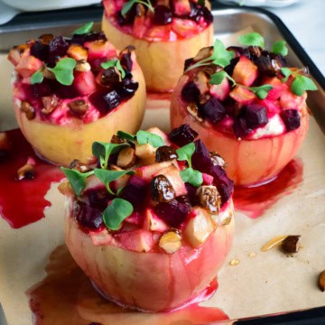 Four savory baked apples topped with apples, beets and honey and stuffed with a ricotta-marscarpone filling.