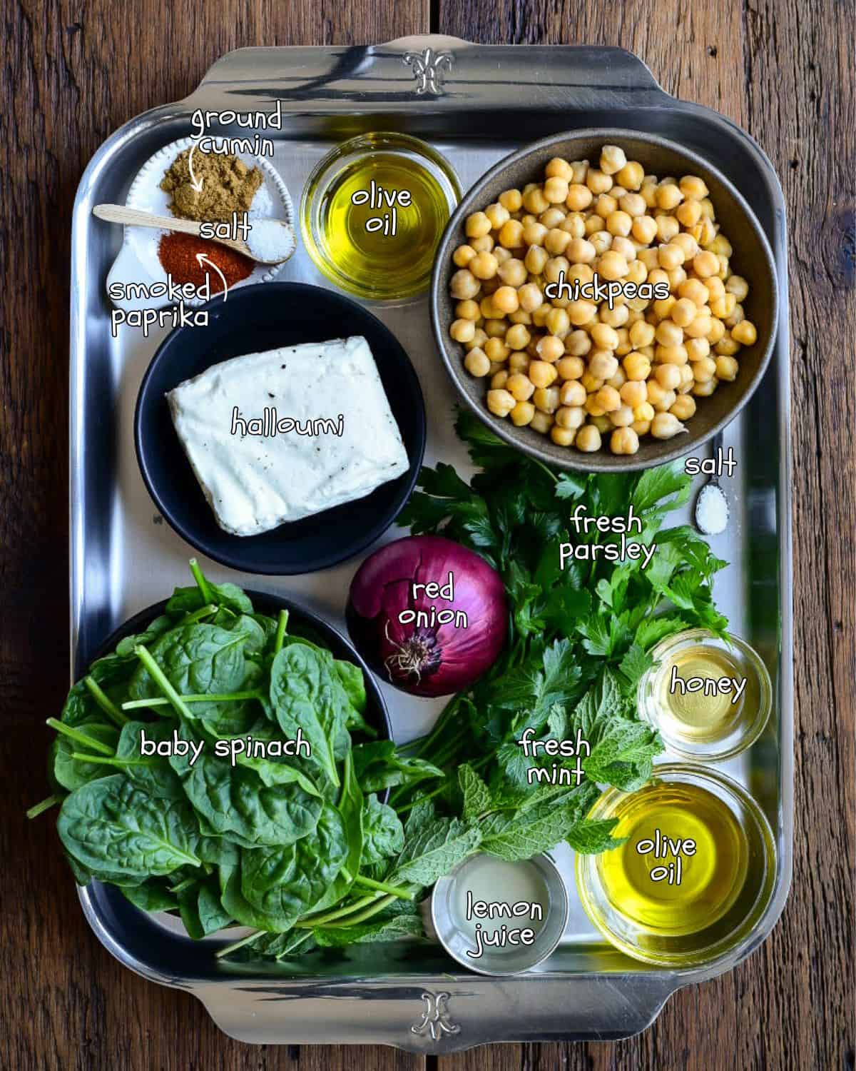 Ingredients for a crispy chickpea and halloumi salad recipe.