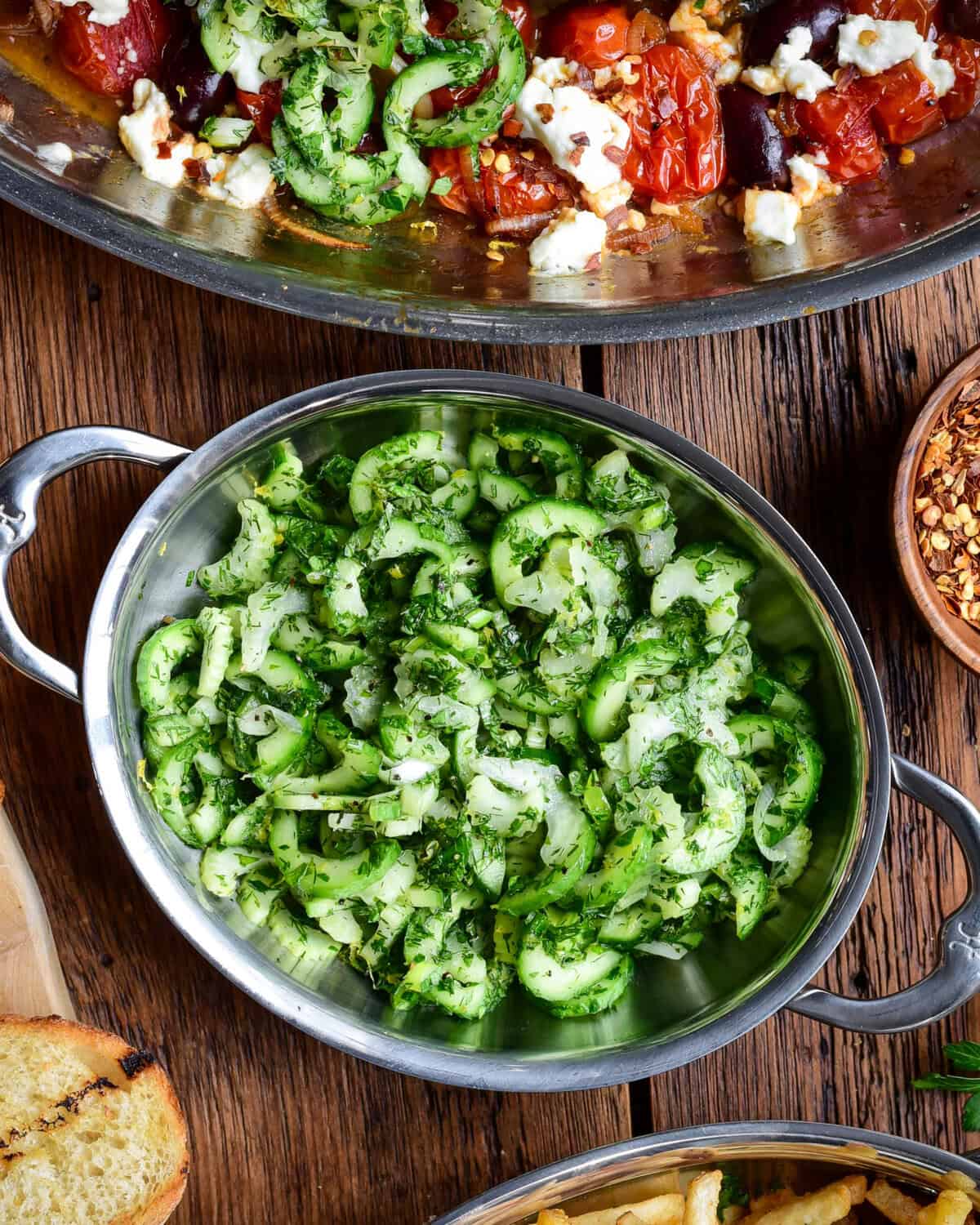 A crunchy cucumber and celery slaw with an herb dressing served in a mini au gratin.