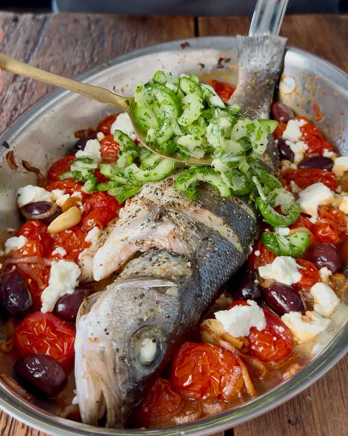 Spoon the cucumber slaw over the fish.
