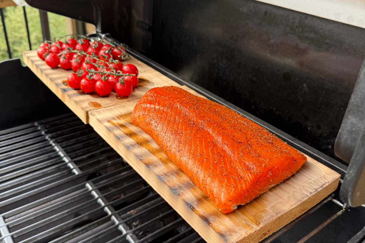 Salmon and tomatoes are cedar planked on the grill.
