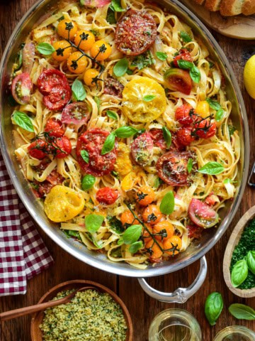 A large oval au gratin filled with a roasted heirloom tomato pasta with lemon-garlic panko and basil. Served with extra panko, lemon zest and extra herbs.