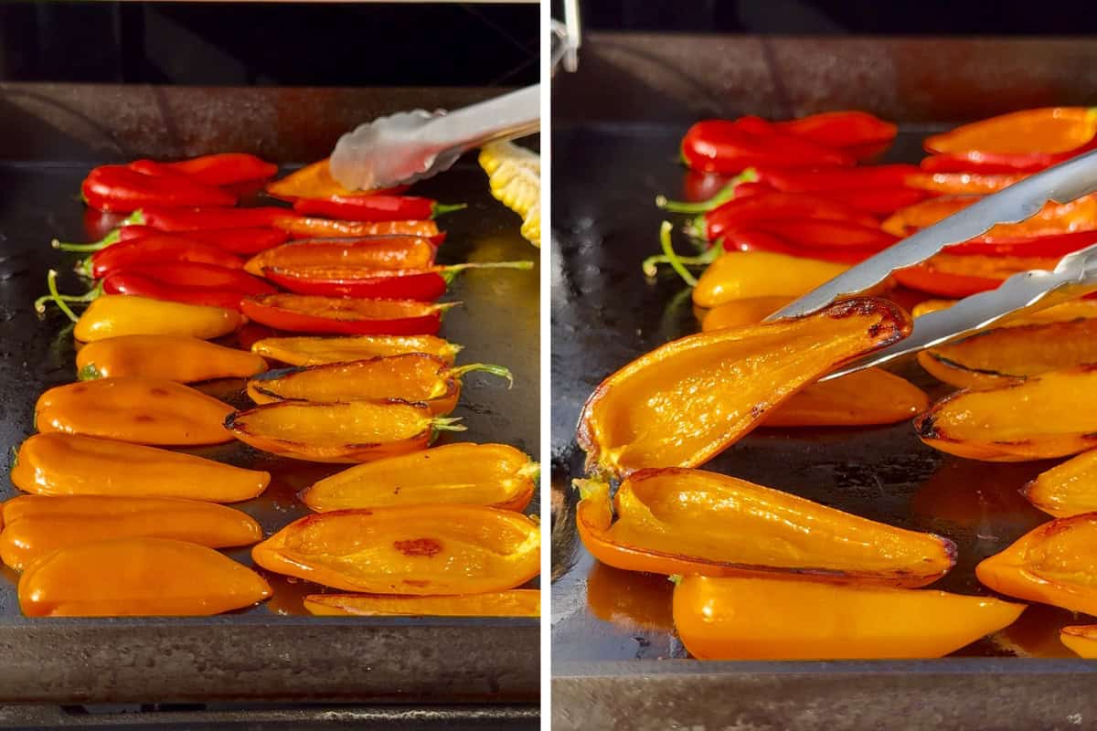 Orange and red mini peppers are cut in half and cooked on a griddle. The peppers are turned with tongs to grill the other side.