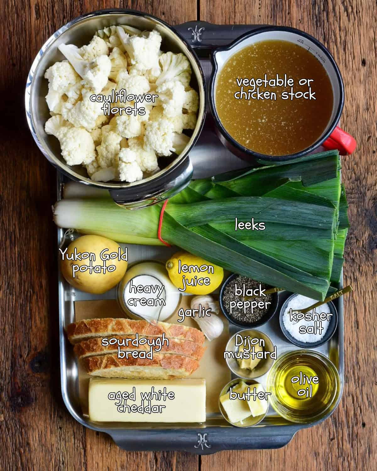 Ingredients are placed in a tray for a potato, cauliflower, and leek soup recipe.
