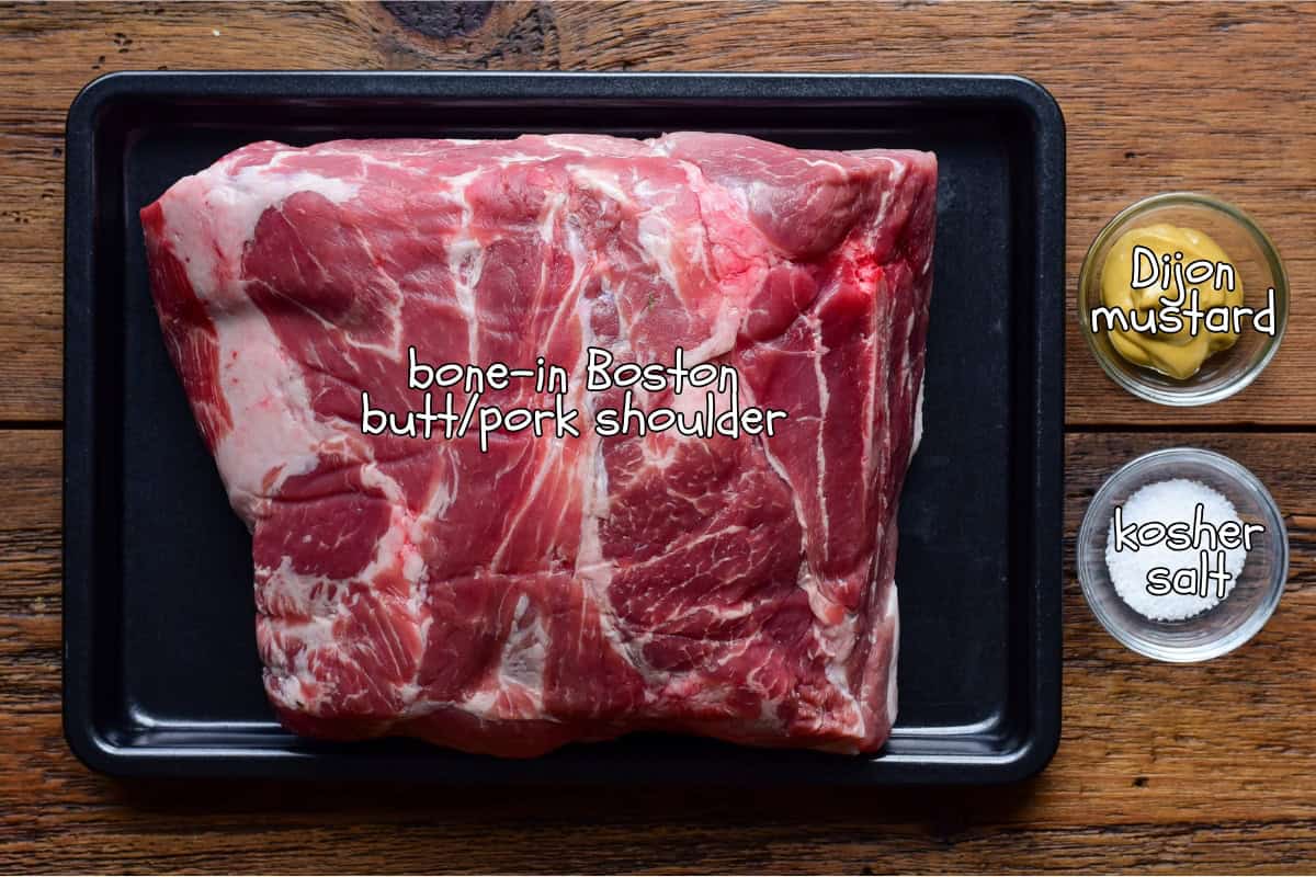 A pork shoulder, salt and mustard for a smoked pulled pork recipe.