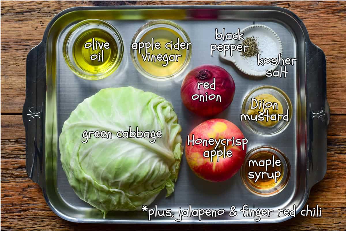 Apple cabbage slaw ingredients on a tray.