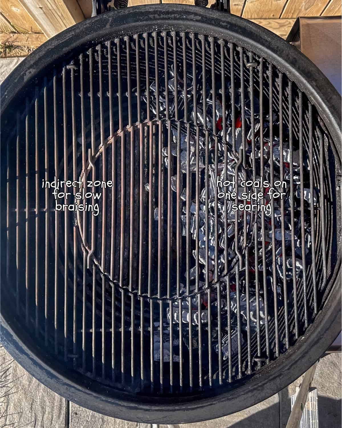 A top-down image of a charcoal grill set up with two zones: An indirect zone (no charcoal) for braising and a direct heat zone (with charcoal) for searing.
