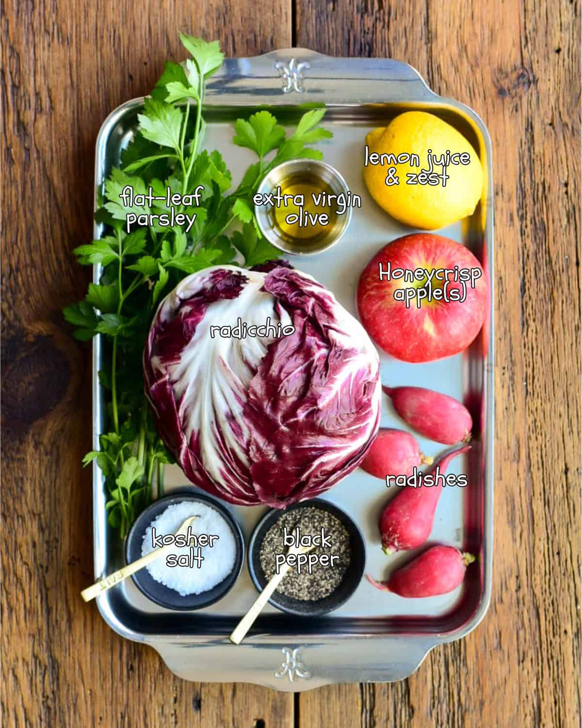 A tray of colourful produce and ingredients for a Honeycrisp Apple & Radicchio Salad with Lemon recipe.