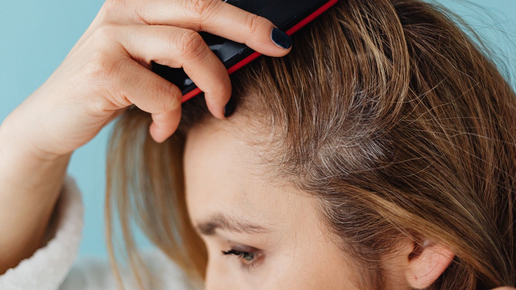 woman brushing her hair