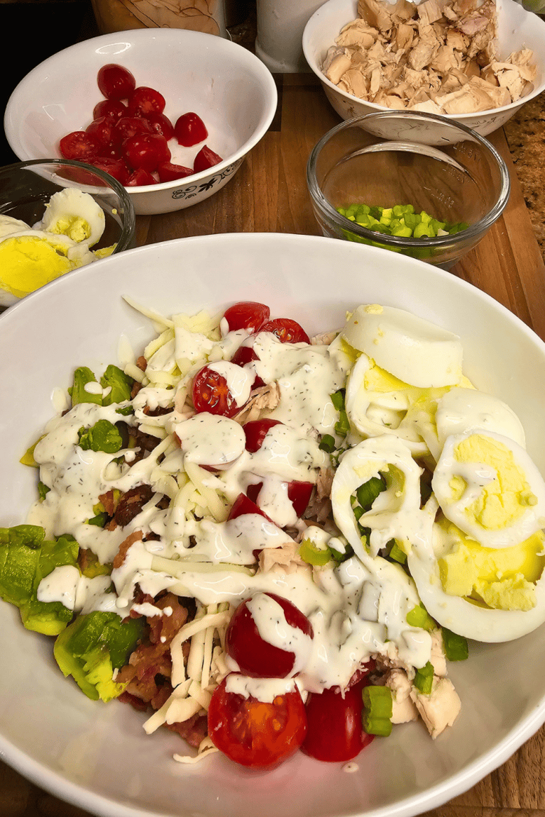 Healthy chicken salad with fresh vegetables and boiled eggs.