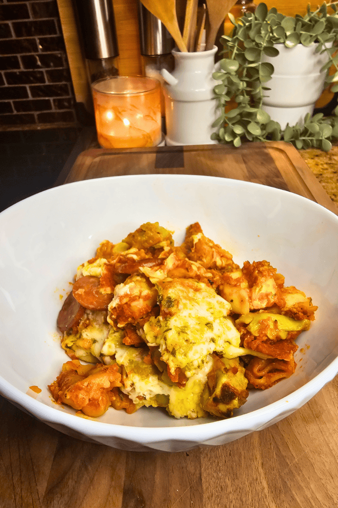 A bowl full of Dump and Bake Pizza Tortellini hot and fresh from the oven