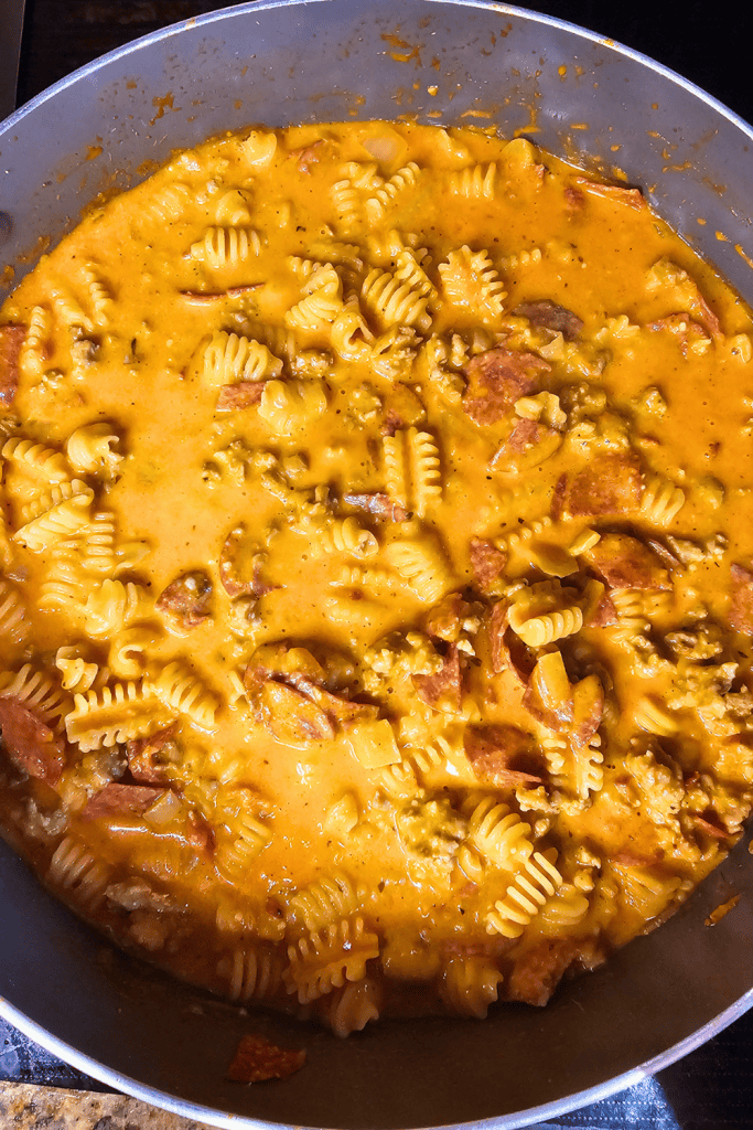 One Pan Cheesy Pizza Pasta cooking in a pan.