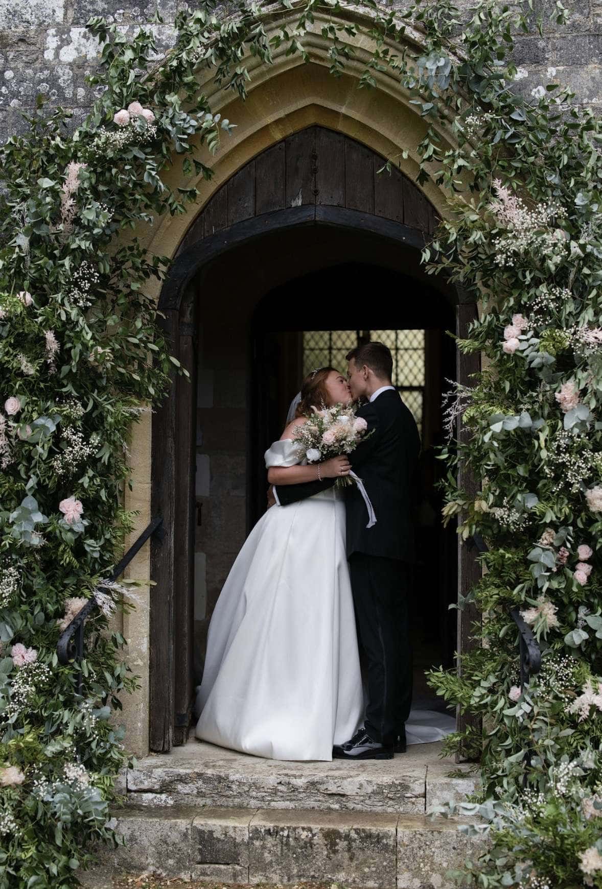 dried floral arch at lulworth castle church