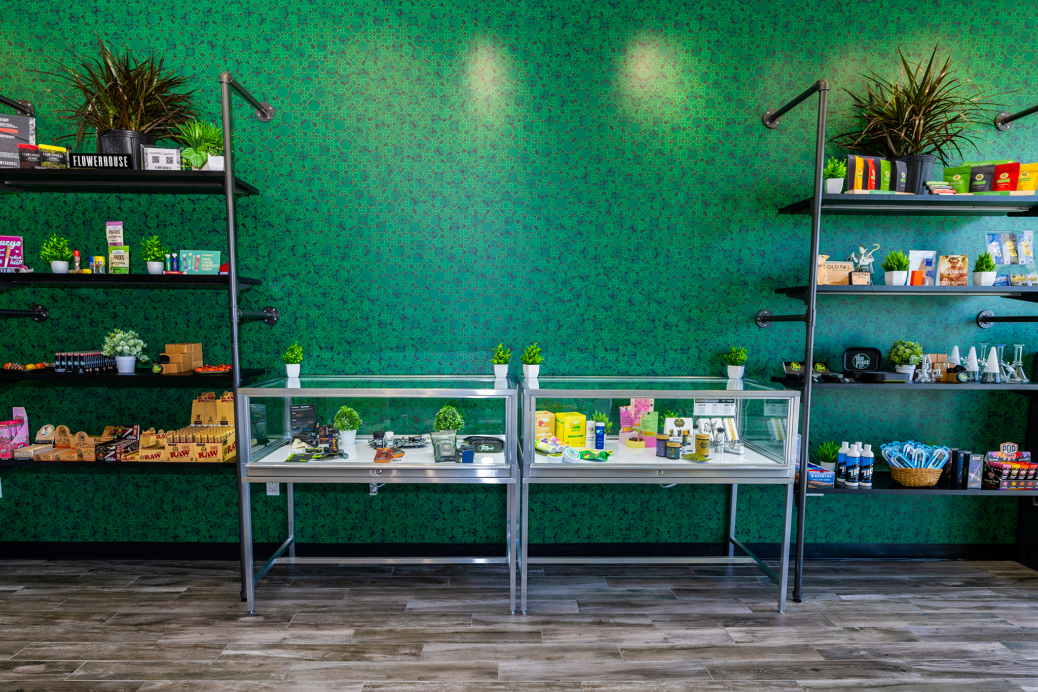 Display cases and wall shelves with assorted cannabis products at The Plant Yonkers dispensary
