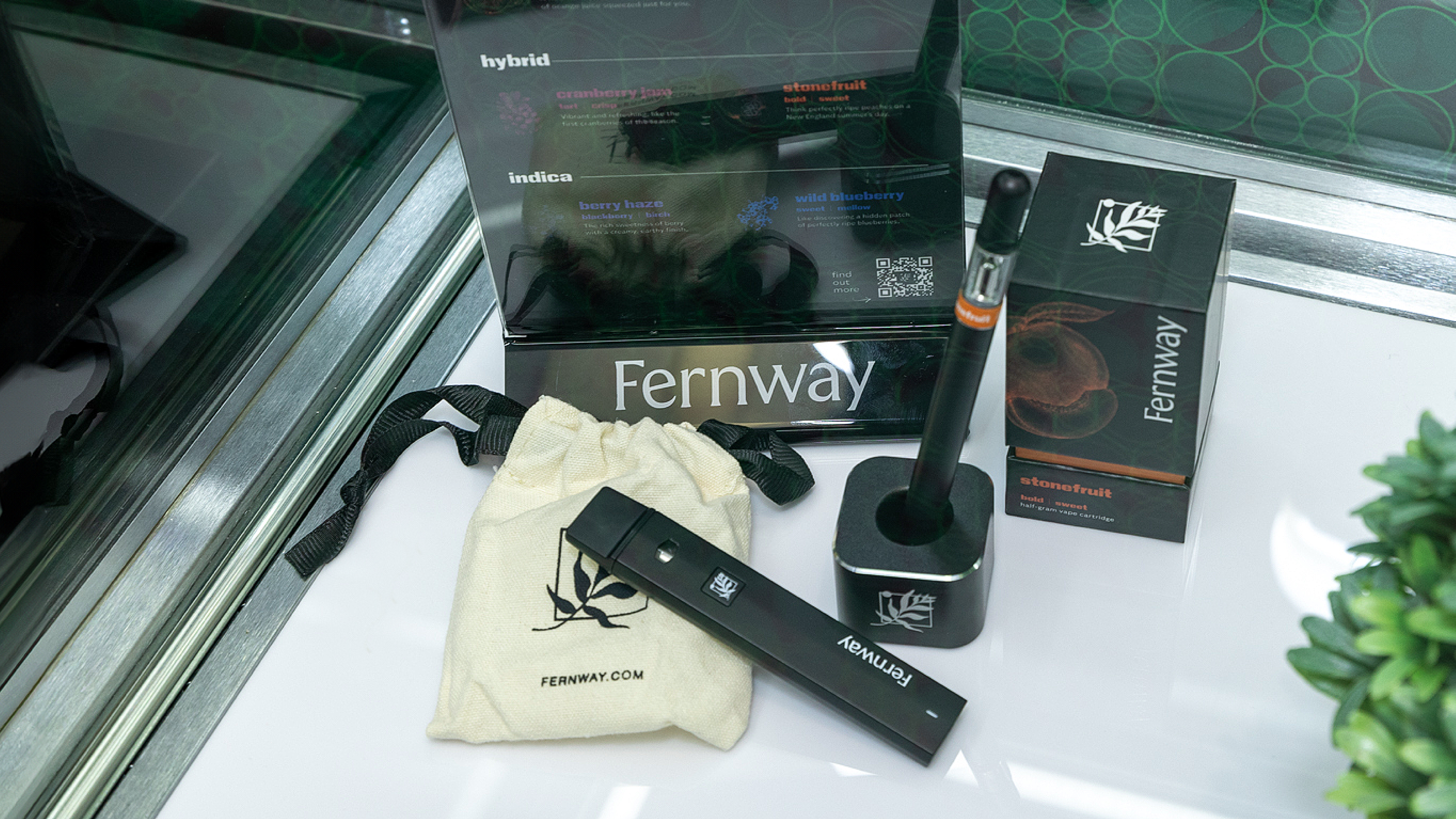 Fernway vape pen, cartridge, pouch, and packaging displayed in dispensary glass case