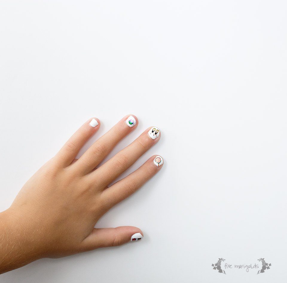 Why didn't I think of that? Use tattoos as nail art. Free Printable Halloween Emoji Nail art. 