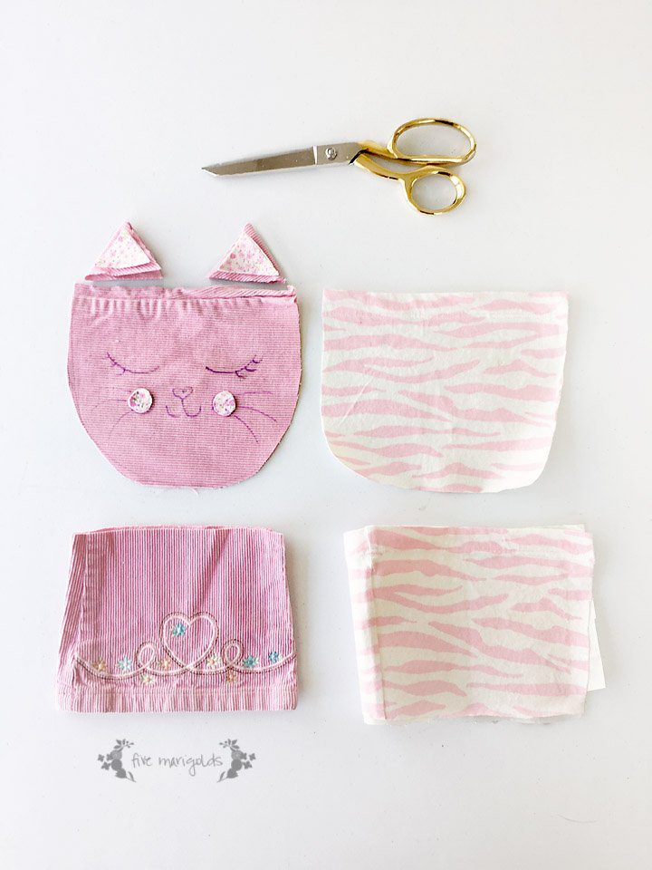 Upcycle your baby clothes with this pants - to - kitty cat purse refashion tutorial.