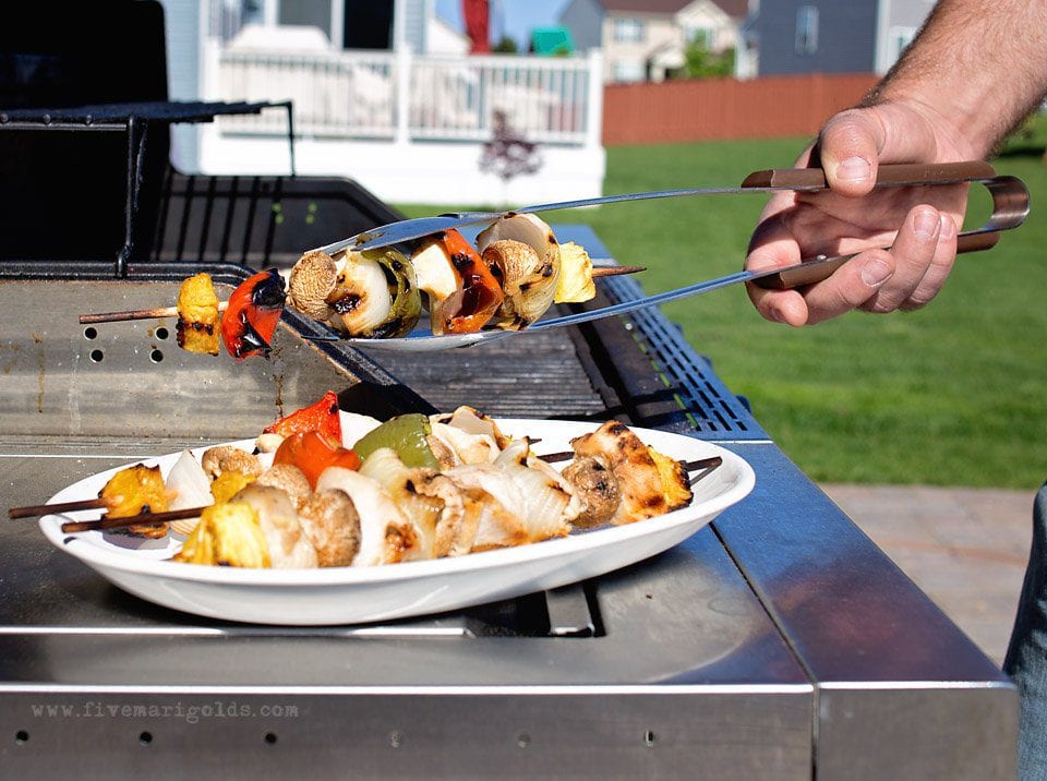 Chill and grill for a laid back summer barbecue. Tutorial for turning a dollar store tablecloth into a custom memory blanket for gatherings. Free printable favor tags for sparklers. 