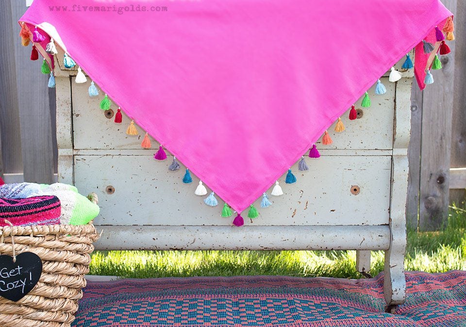Tutorial for turning a dollar store tablecloth into a custom memory blanket for gatherings.