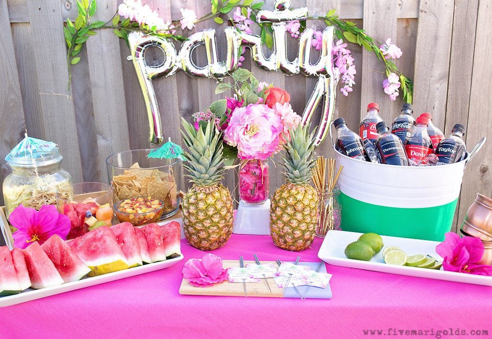 Chill and grill for a laid back summer barbecue. Tutorial for turning a dollar store tablecloth into a custom memory blanket for gatherings. Free printable favor tags for sparklers. 