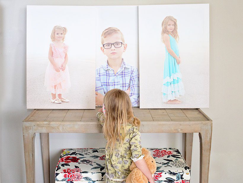 Tips for creating a beautiful and comfortable living space on a budget: custom photo canvases, faux mosaic tile and vintage fabrics and prints.