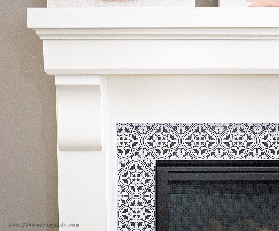 Tips for creating a beautiful and comfortable living space on a budget: custom photo canvases, faux mosaic tile and vintage fabrics and prints.