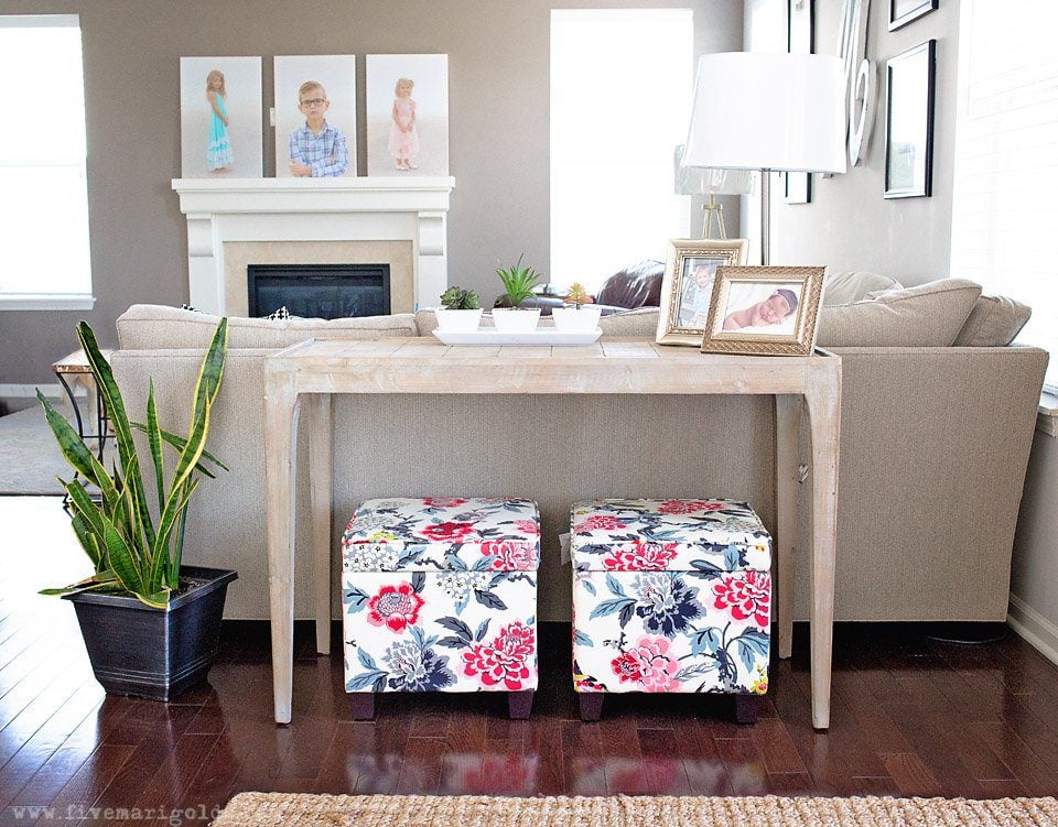 Tips for creating a beautiful and comfortable living space on a budget: custom photo canvases, faux mosaic tile and vintage fabrics and prints.