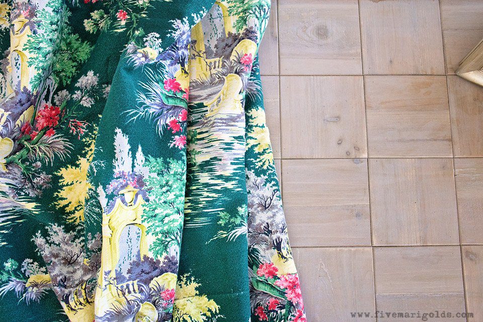 Tips for creating a beautiful and comfortable living space on a budget: custom photo canvases, faux mosaic tile and vintage fabrics and prints.